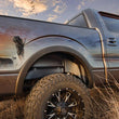 Load image into Gallery viewer, Husky Liners 20-22 Chevrolet Silverado 2500/3500 HD Rear Wheel Well Guards - Black - Side View