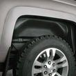 Load image into Gallery viewer, Husky Liners 19-21 Ram 1500 Wheel Well Guards Rear - Black - Installation View