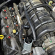 Load image into Gallery viewer, J&amp;L 05-23 Dodge Charger 5.7L Hemi Passenger Side Oil Separator 3.0 - Clear Anodized - Side View
