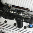 Load image into Gallery viewer, J&amp;L 07-14 Ford Mustang GT500 Passenger Side Oil Separator 3.0 - Black Anodized - Side View