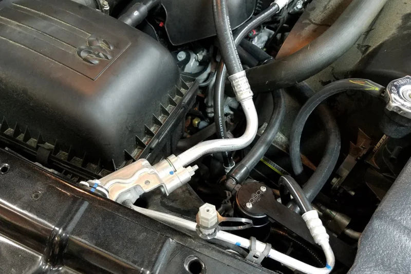 J&L 09-18 Ram 1500 5.7L Passenger Side Oil Separator 3.0 - Black Anodized - Side View
