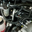 Load image into Gallery viewer, J&amp;L 10-19 Ford Flex EcoBoost V6 Passenger Side Oil Separator 3.0 - Clear Anodized - Side View