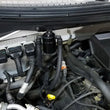 Load image into Gallery viewer, J&amp;L 11-14 Ford F-150/Ford F-150 Raptor 6.2L Passenger Side Oil Separator 3.0 - Black Anodized - Side View
