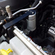Load image into Gallery viewer, J&amp;L 12-17 Jeep Wrangler JK 3.6L Passenger Side Oil Separator 3.0 - Clear Anodized - Side View