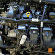 Load image into Gallery viewer, J&amp;L 13-19 Ford Fusion 2.0L EcoBoost Passenger Side Oil Separator 3.0 - Clear Anodized - Side View