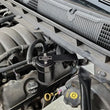 Load image into Gallery viewer, J&amp;L 14-18 Chevy Silverado 1500 / 14-18 GMC Sierra 1500 4.3L V6 Oil Separator - Black Anodized - Side View