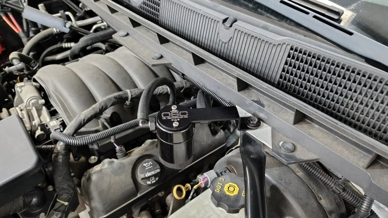 J&L 14-18 Chevy Silverado 1500 / 14-18 GMC Sierra 1500 4.3L V6 Oil Separator - Black Anodized - Side View