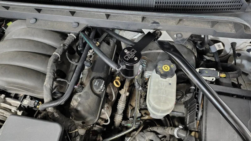 J&L 14-18 Chevy Silverado 1500 / 14-18 GMC Sierra 1500 4.3L V6 Oil Separator - Black Anodized - Detail View