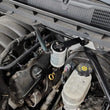 Load image into Gallery viewer, J&amp;L 14-18 Chevy Silverado 1500 / 14-18 GMC Sierra 1500 4.3L V6 Oil Separator - Clear Anodized - Side View