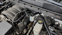 Load image into Gallery viewer, J&amp;L 14-18 Chevy Silverado 1500 / 14-18 GMC Sierra 1500 4.3L V6 Oil Separator - Clear Anodized - Side View
