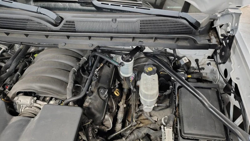 J&L 14-18 Chevy Silverado 1500 / 14-18 GMC Sierra 1500 4.3L V6 Oil Separator - Clear Anodized - Detail View