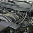 Load image into Gallery viewer, J&amp;L 14-18 Chevy/GM Truck/SUV 5.3L V8 Driver Side Oil Separator 3.0 - Black Anodized - Side View