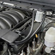 Load image into Gallery viewer, J&amp;L 14-18 Chevy/GM Truck/SUV 5.3L V8 Driver Side Oil Separator 3.0 - Clear Anodized - Side View
