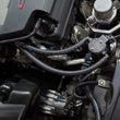 Load image into Gallery viewer, J&amp;L 14-19 Chevrolet Corvette LT1 6.2L Driver Side Oil Separator 3.0 - Black Anodized - Side View