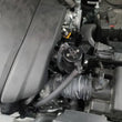Load image into Gallery viewer, J&amp;L 14-24 Mazda CX5 2.5L Non-turbo Driver Side 3.0 Oil Separator Kit - Black Anodized - Side View
