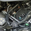 Load image into Gallery viewer, J&amp;L 15-25 Ford Transit 150/250/350 3.5L EcoBoost Passenger Side Oil Separator 3.0 - Black Anodized - Side View
