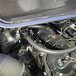 Load image into Gallery viewer, J&amp;L 15-25 Ford Transit 150/250/350 3.5L EcoBoost Passenger Side Oil Separator 3.0 - Black Anodized - Detail View