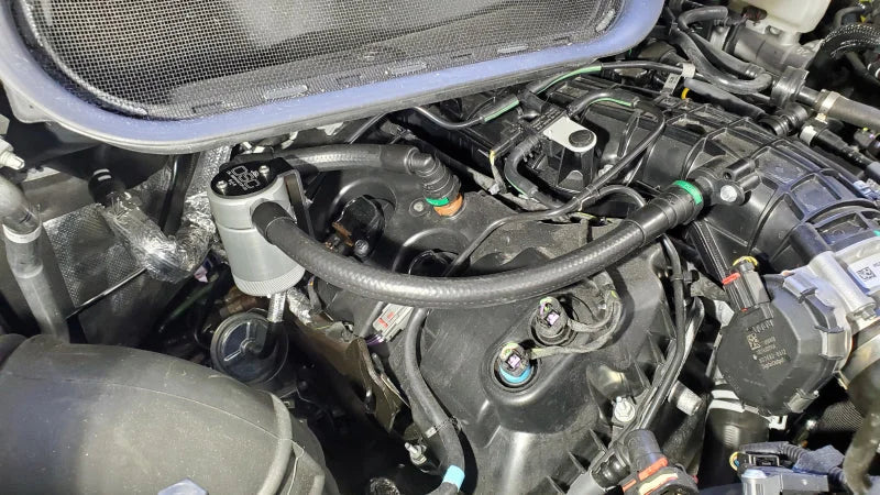 J&L 15-25 Ford Transit 150/250/350 3.5L EcoBoost Passenger Side Oil Separator 3.0 - Clear Anodized - Detail View