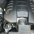 Load image into Gallery viewer, J&amp;L 16-17 Chevrolet SS 6.2L Passenger Side Oil Separator 3.0 - Clear Anodized - Side View