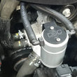 Load image into Gallery viewer, J&amp;L 16-17 Chevrolet SS 6.2L Passenger Side Oil Separator 3.0 - Clear Anodized - Detail View