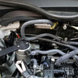 Load image into Gallery viewer, J&amp;L 16-21 Honda Civic 1.5L Turbo (EX &amp; Si) Passenger Side Oil Separator 3.0 - Clear Anodized - Side View