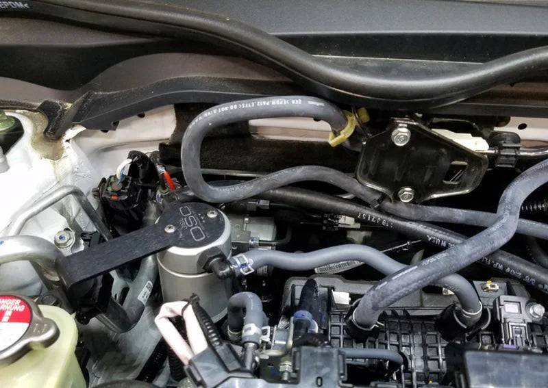 J&L 16-21 Honda Civic 1.5L Turbo (EX & Si) Passenger Side Oil Separator 3.0 - Clear Anodized - Side View