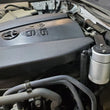 Load image into Gallery viewer, J&amp;L 16-23 Toyota Tacoma 3.5L Driver Side Oil Separator 3.0 - Clear Anodized - Side View