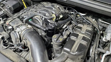 Load image into Gallery viewer, J&amp;L 16-24 Dodge Durango / Jeep Grand Cherokee 3.6L Oil Separator 3.0 Passenger Side - Black Anod - Side View