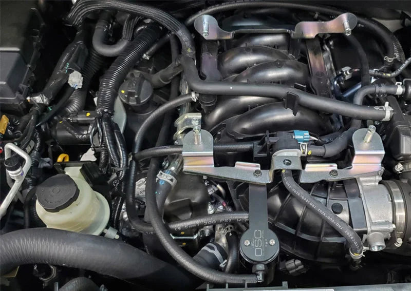J&L 16-24 Nissan Titan 5.6L Passenger Side Oil Separator 3.0 - Black Anodized - Detail View