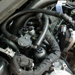 Load image into Gallery viewer, J&amp;L 17-19 Ford Fusion Sport 2.7L Passenger Side Oil Separator 3.0 - Black Anodized - Side View