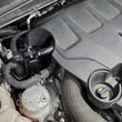Load image into Gallery viewer, J&amp;L 17-20 Lincoln Continental/MKZ 3.0L EcoBoost Passenger Side Oil Separator 3.0 - Black Anodized - Detail View