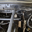 Load image into Gallery viewer, J&amp;L 17-22 Ford F-250 6.2L/7.3L Passenger Side Oil Separator 3.0 - Black Anodized - Side View