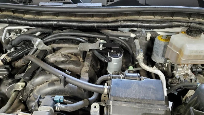 J&L 17-24 Nissan Armada / 14-24 Infiniti QX80 5.6L Driver Side Oil Separator 3.0 - Clear Anodize - Side View
