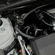Load image into Gallery viewer, J&amp;L 18-24 Toyota Camry 3.5L V6 Oil Separator 3.0 Passenger Side - Black Anodized - Side View