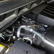 Load image into Gallery viewer, J&amp;L 19-23 Chevy Silverado/GMC Sierra 1500 2.7L Passenger Side Oil Separator 3.0 - Clear Anodized - Side View