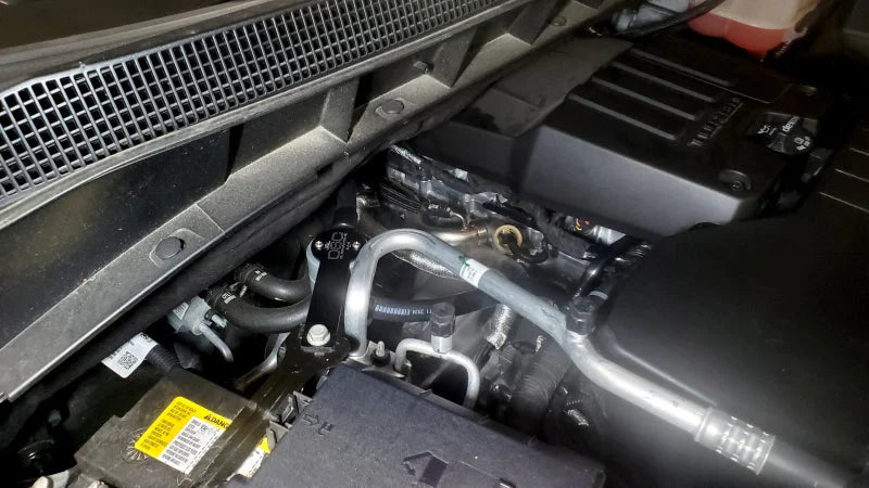 J&L 19-23 Chevy Silverado/GMC Sierra 1500 2.7L Passenger Side Oil Separator 3.0 - Clear Anodized - Side View