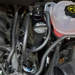 Load image into Gallery viewer, J&amp;L 19-25 Chevrolet Silverado/GMC Sierra 1500 5.3L V8 Driver Side Oil Separator 3.0 - Black Anodized - Side View