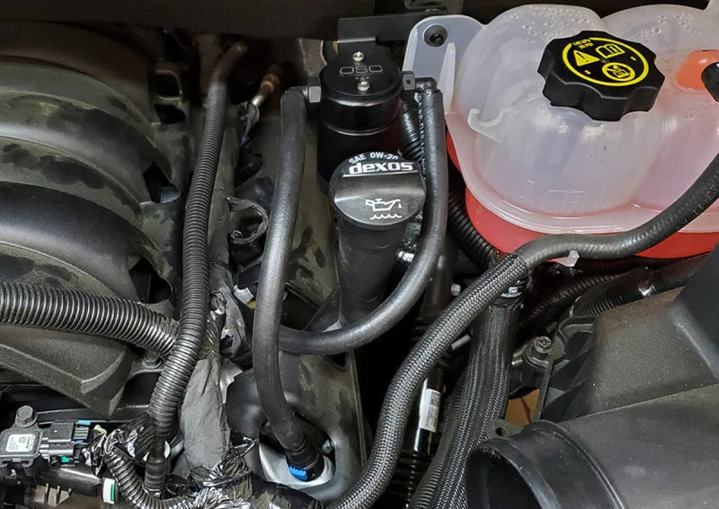 J&L 19-25 Chevrolet Silverado/GMC Sierra 1500 5.3L V8 Driver Side Oil Separator 3.0 - Black Anodized - Side View