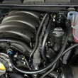 Load image into Gallery viewer, J&amp;L 19-25 Chevrolet Silverado/GMC Sierra 1500 5.3L V8 Driver Side Oil Separator 3.0 - Black Anodized - Detail View