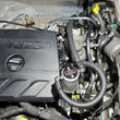 Load image into Gallery viewer, J&amp;L 20-23 Buick Encore GX / Chevrolet Trailblazer Driver Side Oil Separator 3.0 - Clear Anodized - Side View