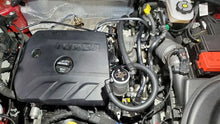 Load image into Gallery viewer, J&amp;L 20-23 Buick Encore GX / Chevrolet Trailblazer Driver Side Oil Separator 3.0 - Clear Anodized - Side View