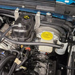 Load image into Gallery viewer, J&amp;L 20-24 Jeep Wrangler 2.0L Driver Side Oil Separator 3.0 - Clear Anodized - Side View