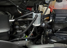 Load image into Gallery viewer, J&amp;L 20-25 Chevy Silverado/GMC Sierra 2500/3500 6.6L Drivers Side Oil Separator 3.0 - Clear Anodized - Side View