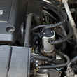 Load image into Gallery viewer, J&amp;L 2005-2019 Nissan Frontier 4L Oil Separator 3.0 - Clear Anodized - Side View