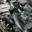 Load image into Gallery viewer, J&amp;L 2011-2025 Ford F-150 2.7L/3.5L/5.0L Passenger Side Oil Separator 3.0 - Black Anodized - Installation View