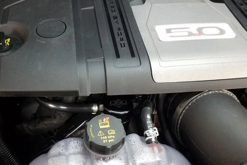 J&L 2018-2023 Ford Mustang GT Passenger Side Oil Separator 3.0 - Black Anodized - Installation View