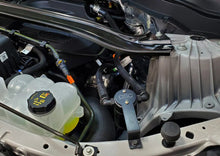 Load image into Gallery viewer, J&amp;L 2020-2024 Ford Explorer 2.3L EcoBoost Driver Side Oil Separator 3.0 - Black Anodized - Side View