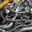 Load image into Gallery viewer, J&amp;L 2021-2025 Ford Bronco 2.7L 3.0 Oil Separator Passenger Side- Clear Anodized - Side View
