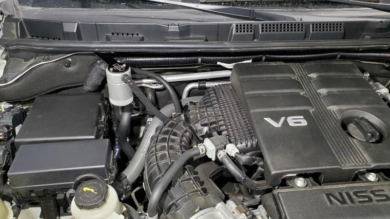 J&L 2022-2025 Nissan Frontier 3.8L V6 Passenger Side Oil Separator 3.0 - Clear Anodized - Side View