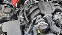 Load image into Gallery viewer, J&amp;L 22-25 Subaru BRZ/GR86 2.4L Passenger Side Oil Separator 3.0 - Black Anodized - Side View